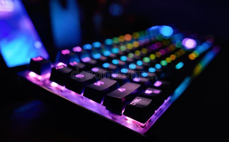 Premium Gaming RGB LED Backlit Keyboard. Mostly Purple and Blue. Side ...