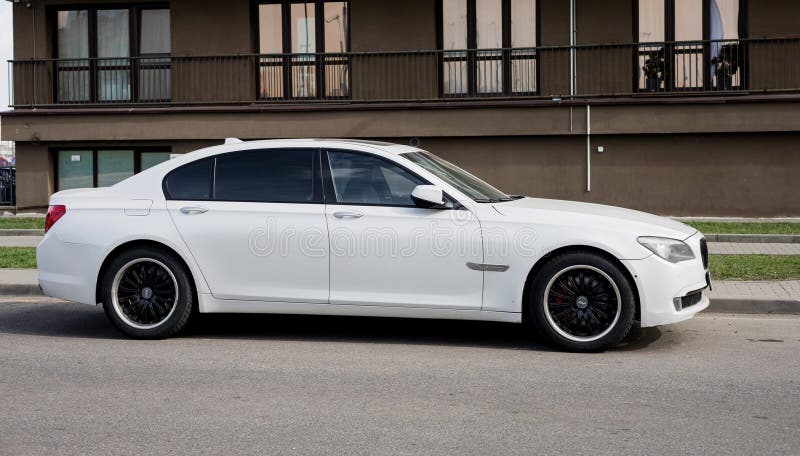 Minsk, Belarus, May 3, 2024 - Premium White BMW in the city street. Side view