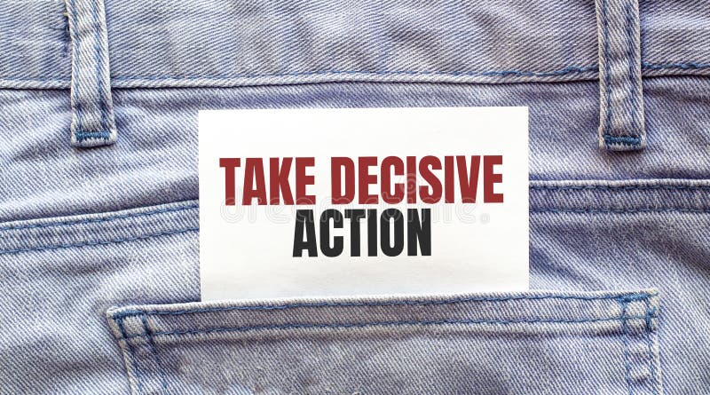 TAKE DECISIVE ACTION words on a white paper stuck out from jeans pocket. Business concept. TAKE DECISIVE ACTION words on a white paper stuck out from jeans pocket. Business concept.