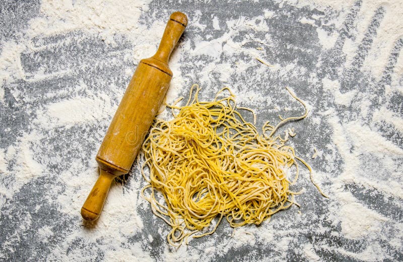 The Preparated Noodles with a Rolling Pin . Stock Photo Image of