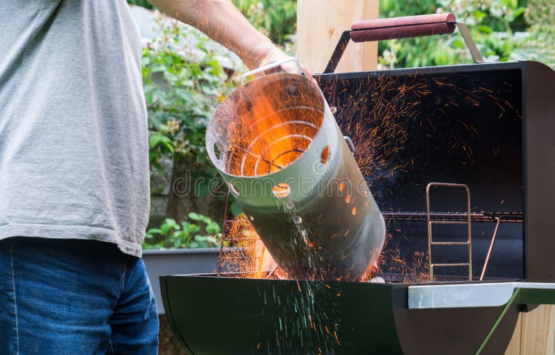 Preparation of barbeque grill using chimney starter for igniting charcoal or briquettes