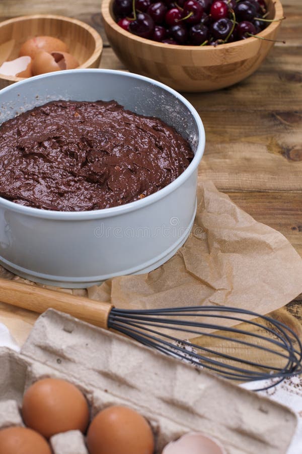 Preparation of a chocolate cake with a cherry. Traditional American cake. Ingredients for baking. Copy space