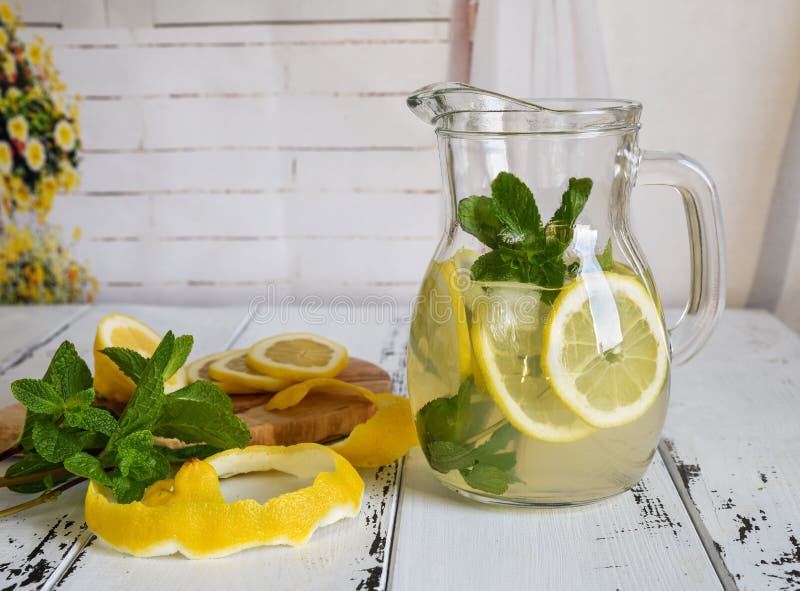 Preparation of the Lemonade Drink Lemonade in the Jug and Lemons Stock