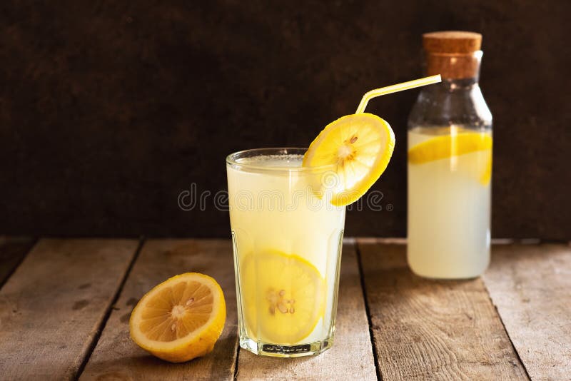 Preparation of the Lemonade Drink. Lemonade in the Jug and Lemons with