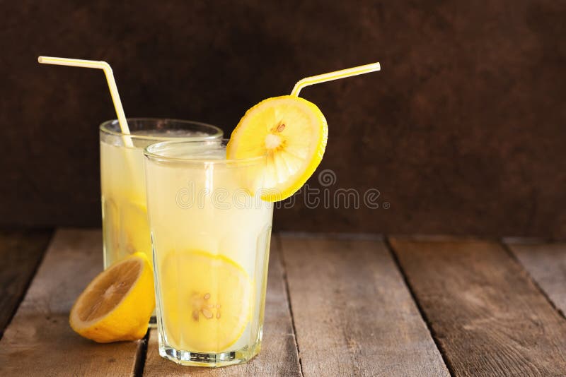 Preparation of the Lemonade Drink. Lemonade in the Jug and Lemons with