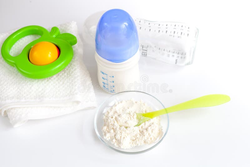 Preparation of mixture baby feeding on white background