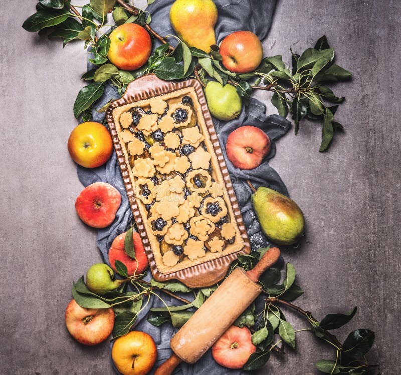 Preparation of open fruits pie with organic ingredients from garden, top view. Clean seasonal food. Flat lay