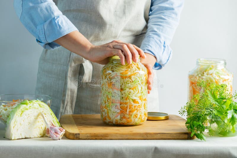 The Preparation Process Fermentation Preservation Sauerkraut on a Light ... - Preparation Process Fermentation Preservation Sauerkraut Light BackgrounD Natural Rustic Style CanneD FooD 157010648