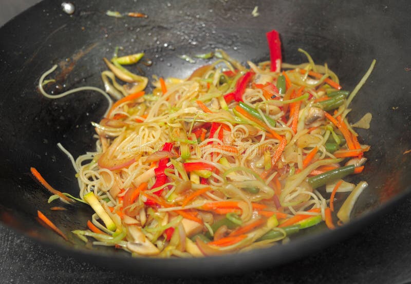 Preparation of Thai noodles vok with vegetables