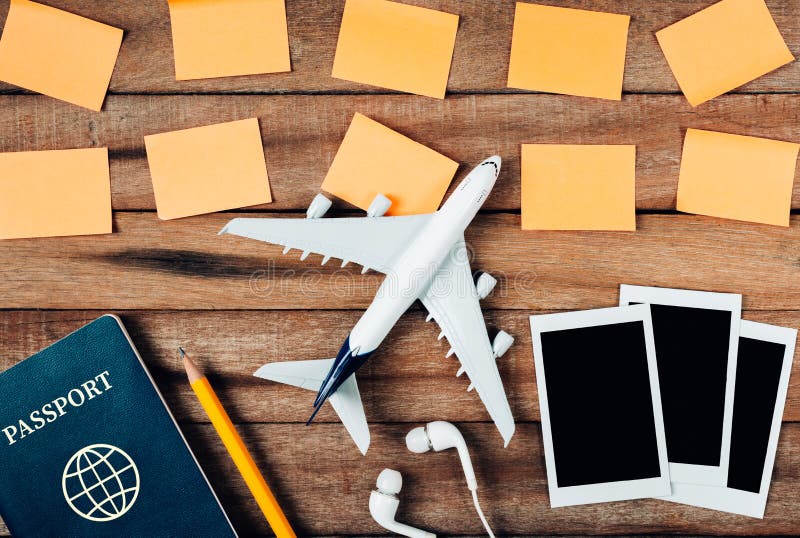 Preparation for Traveling concept and to do list, paper noted, airplane, photo frame, ear phone, pencil, passport. stock image