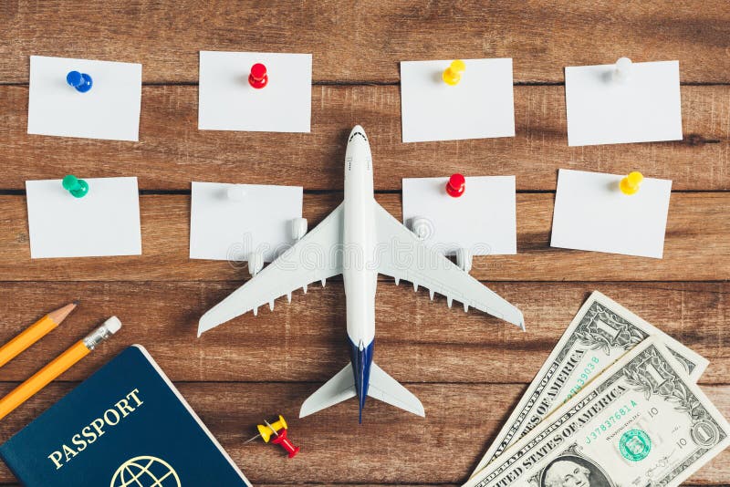 Preparation for Traveling concept and to do list, the paper noted, pencil, money, passport, airplane, colorful push pin. royalty free stock photography