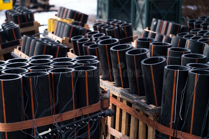 Preparation of big firework show with tubes filled with gunpowder and electric wire on ground. Fireworks festival, entertainment, danger. Preparation of big firework show with tubes filled with gunpowder and electric wire on ground. Fireworks festival, entertainment, danger.