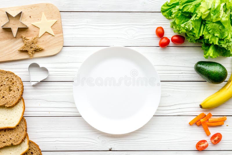 Download Prepare Healthy Breakfast For Children. Meal With Vegetables And Fruits. White Wooden Background ...
