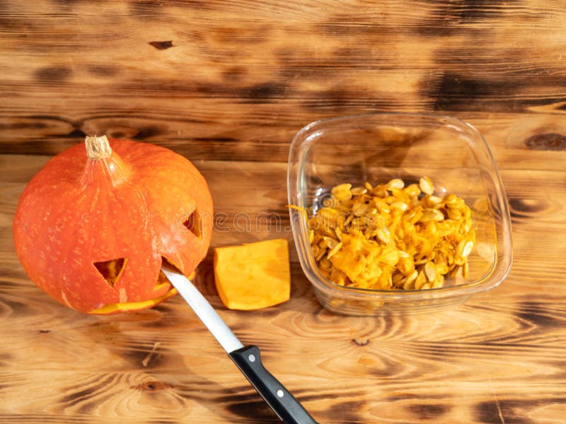 prepare-pumpkin-for-halloween-carve-out-the-pumpkin-s-face-stock-photo