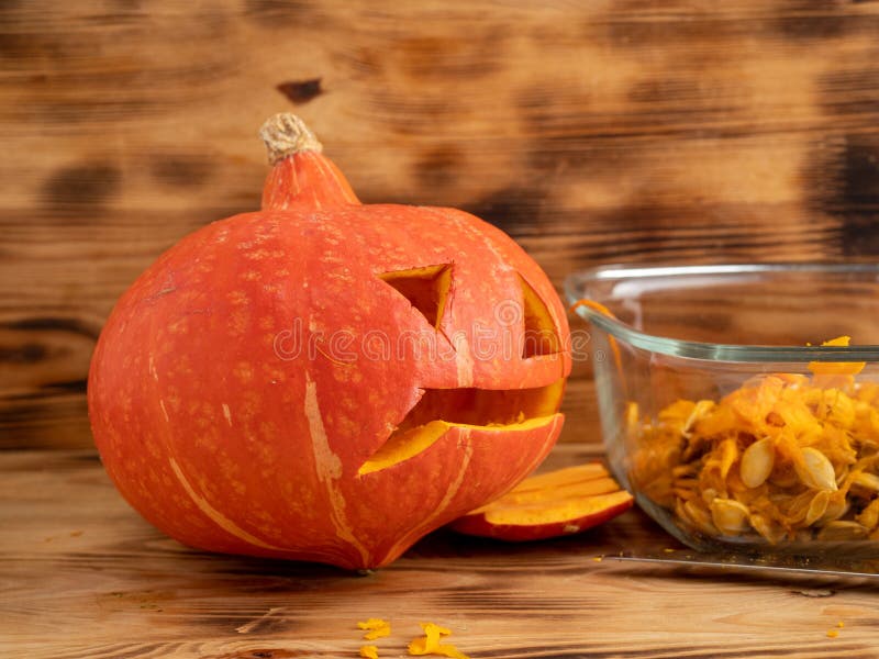 prepare-pumpkin-for-halloween-carve-out-the-pumpkin-s-face-stock-image