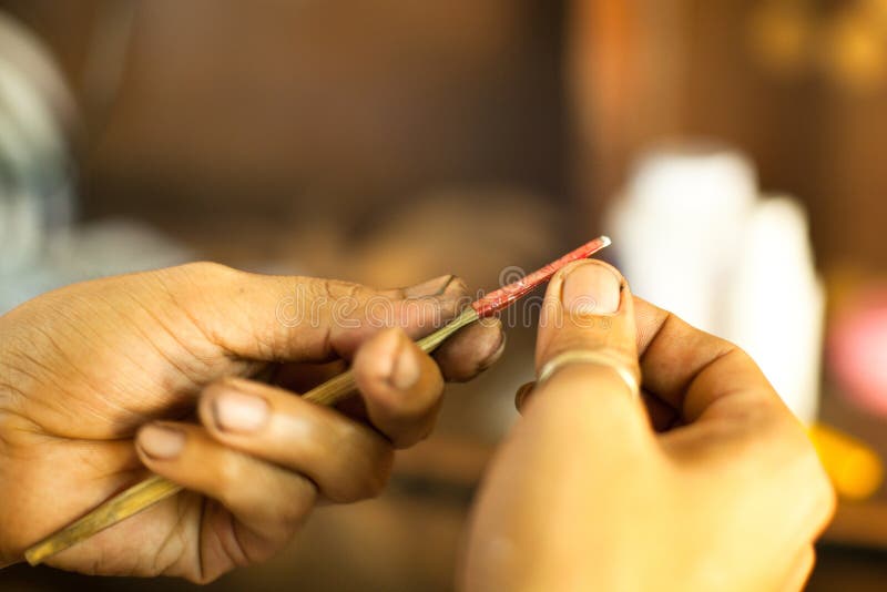 Unidentified master prepare tools for traditional tattoo bamboo, Dec 24, 2012 in Koh Chang. Thai tattooists are very popular among tourists prices range from 500 baht and up