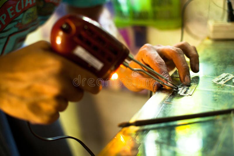 Unidentified master prepare tools for traditional tattoo bamboo, Dec 24, 2012 in Koh Chang. Thai tattooists are very popular among tourists prices range from 500 baht and up