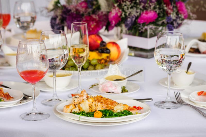 Prepared lobster and sea weed served on plates. Prepared lobster and sea weed served on plates.