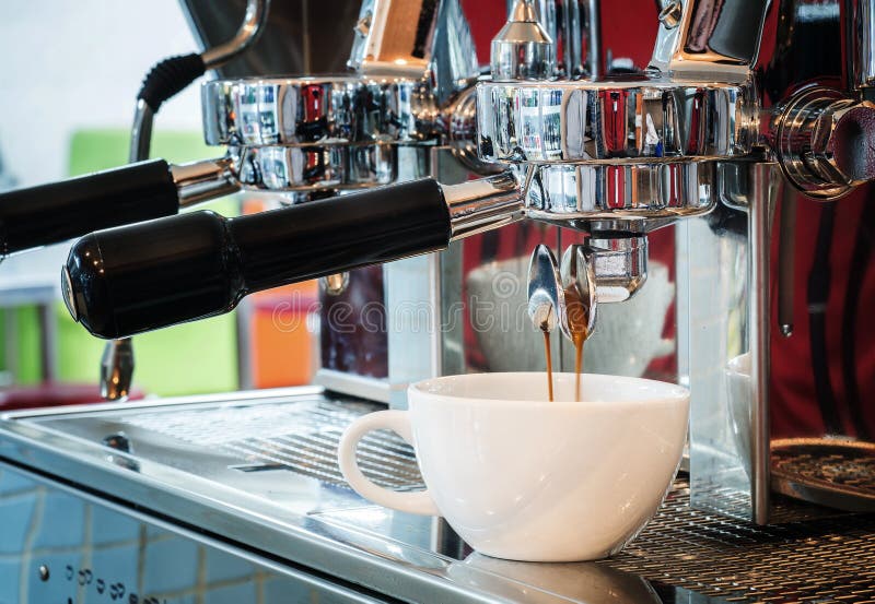 Prepares Espresso Pouring from Coffee Machine in Coffee Shop at Cafe