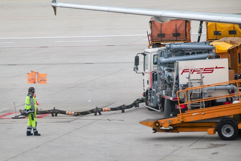 Preparing for the Flight. Working on the Tarmac or Apron of an Airport