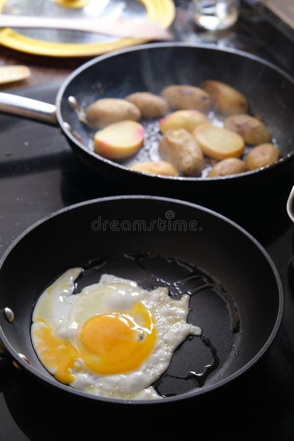 Preparing Fried Eggs in a Frying Pan Stock Photo Image of dinner