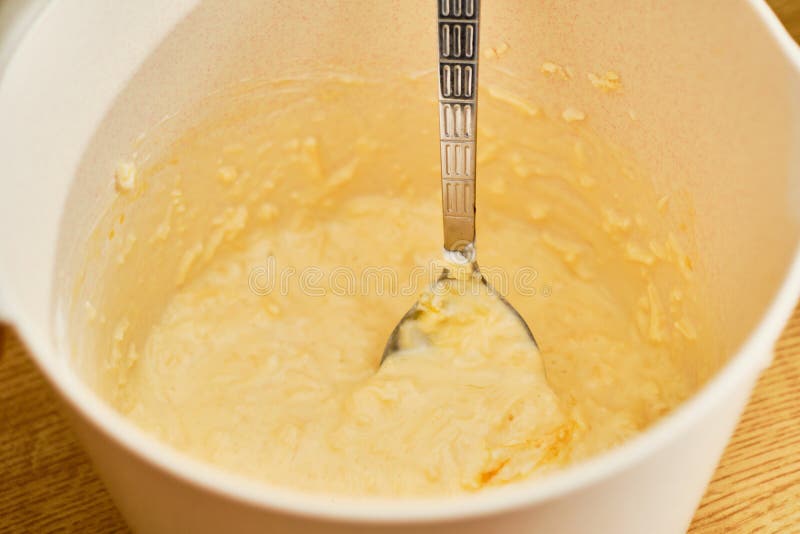 Preparing gluten free cheese dought in bowl - curd and grated cheese with egg. Dought stock images, royalty-free photos and pictures