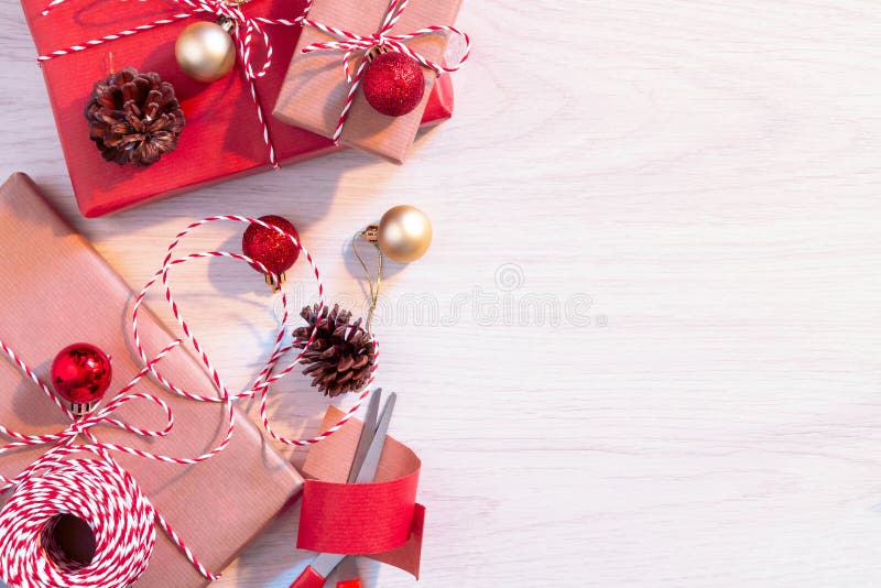 Preparing for the Holiday - Wrapping Christmas or Christmas Gifts in Red  and Beige Wrapping Paper Stock Image - Image of ornament, design: 147120477