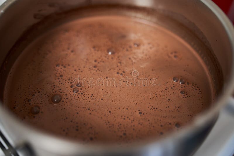 Preparing Homemade Chocolate Pudding, Closeup on Hands Stock Photo