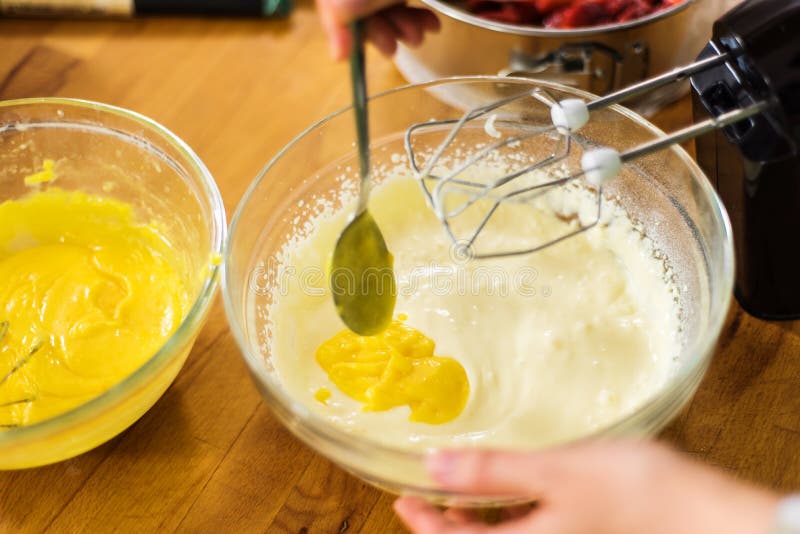 Preparing lemon curd cheesecake batter