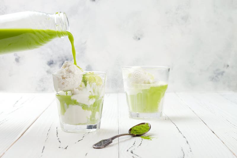 Preparing matcha green tea affogato with vegan coconut ice cream.