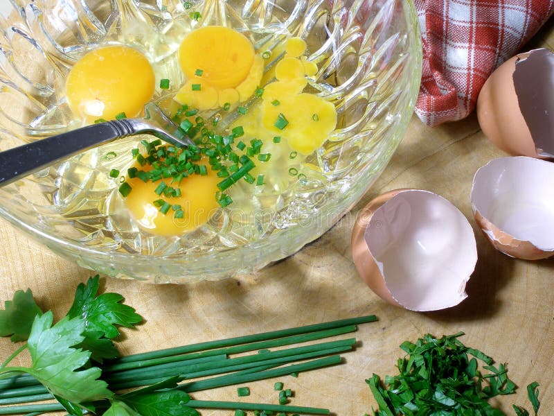 Preparing an Omlet with Chives and Parsley Stock Photo Image of eggs, chives 779928