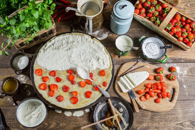 Preparing for pancakes with strawberry