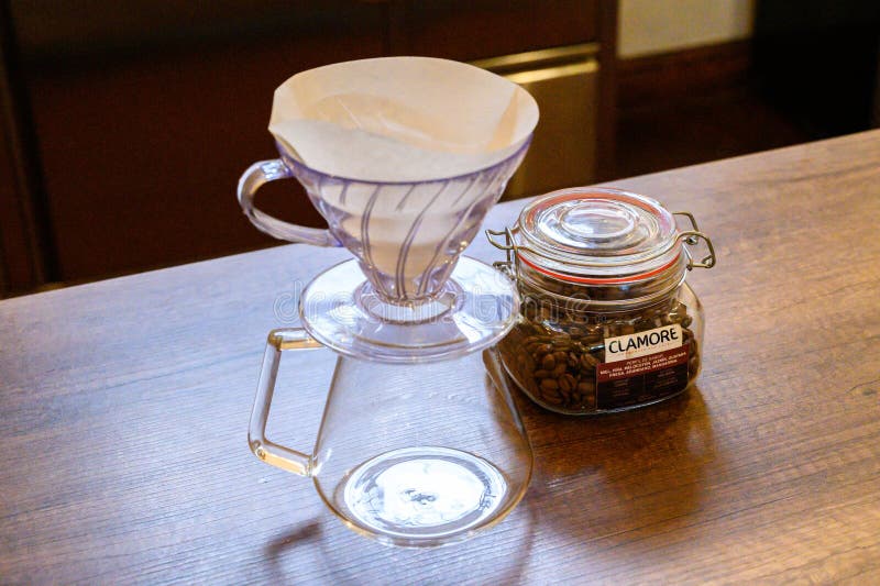 Preparing pour over coffee with beans and dripper royalty free stock images