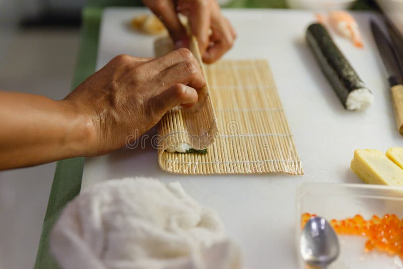 Preparing Rice and Seaweed before Rolling Sushi Roll by Using Bamboo