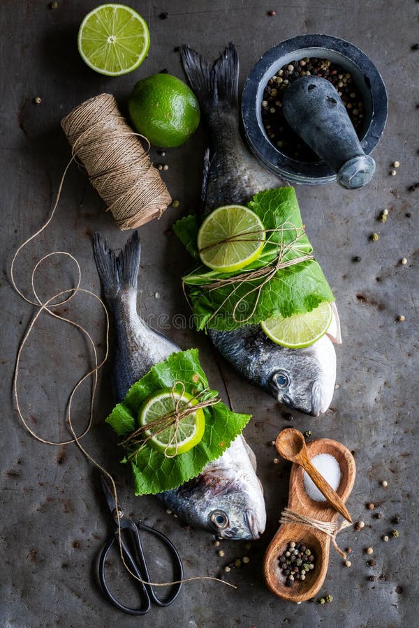 Preparing Whole Fish with Salt and Pepper Stock Image Image of
