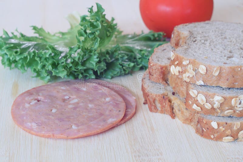 Preparing Whole Wheat Bread and Ham To Make Sandwich Stock Photo