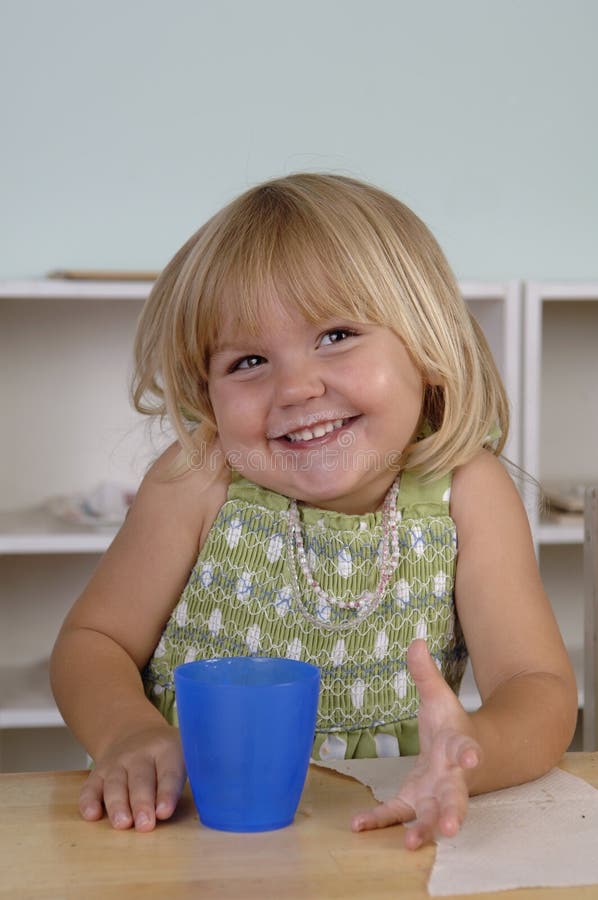 Young girl eats her snack during the break at her preschool classes. Happy multiethnic boys stock images, royalty-free photos and pictures