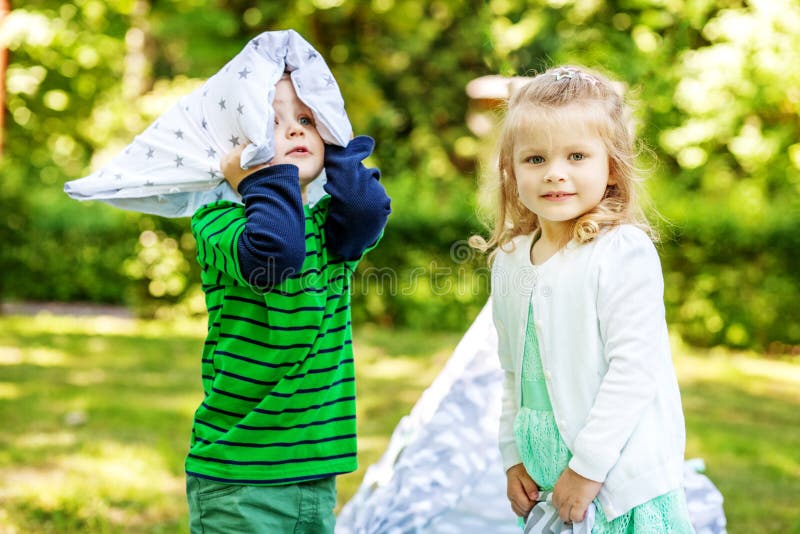 Preschool children play in the park. 2-3 years. Girl and boy. Th royalty free stock photos Preschool children play in the park. 2-3 years. Girl and boy. Th royalty free stock photos