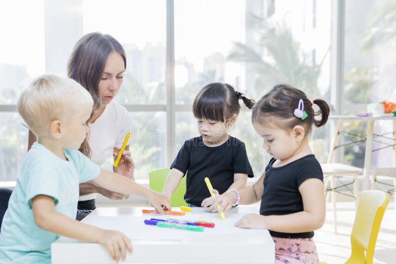 Preschool Kids Learns To Draw with Their Teacher Stock Image Image of