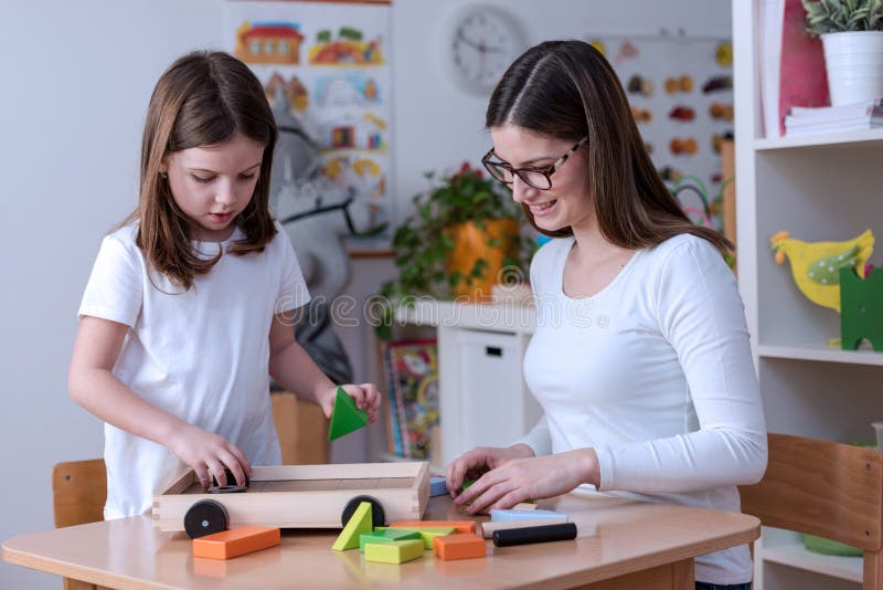 Preschool Teacher with Kid Having Creative Educational Activities Stock