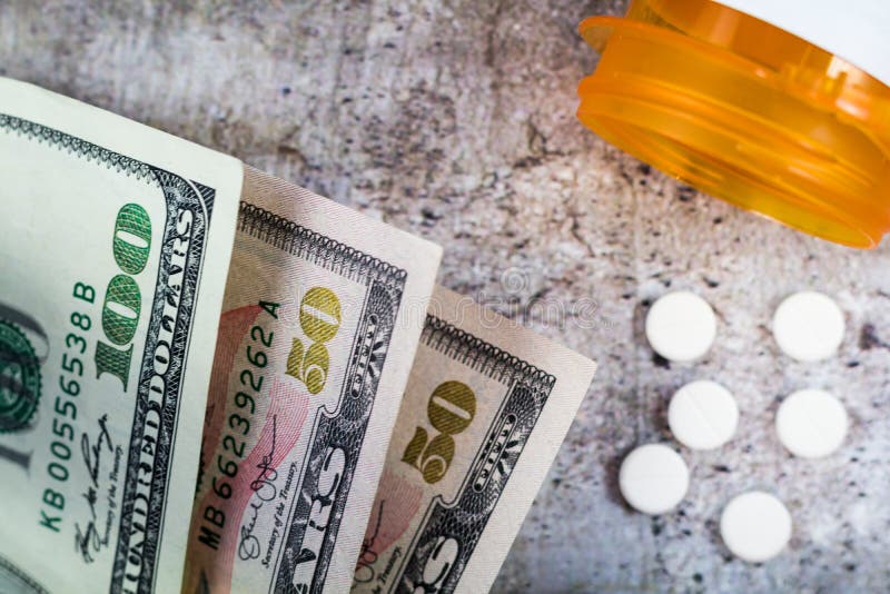 Prescription drugs in the USA are expensive, concept, Rx on US dollars, flat lay royalty free stock image Prescription drugs in the USA are expensive, concept, Rx on US dollars, flat lay royalty free stock image