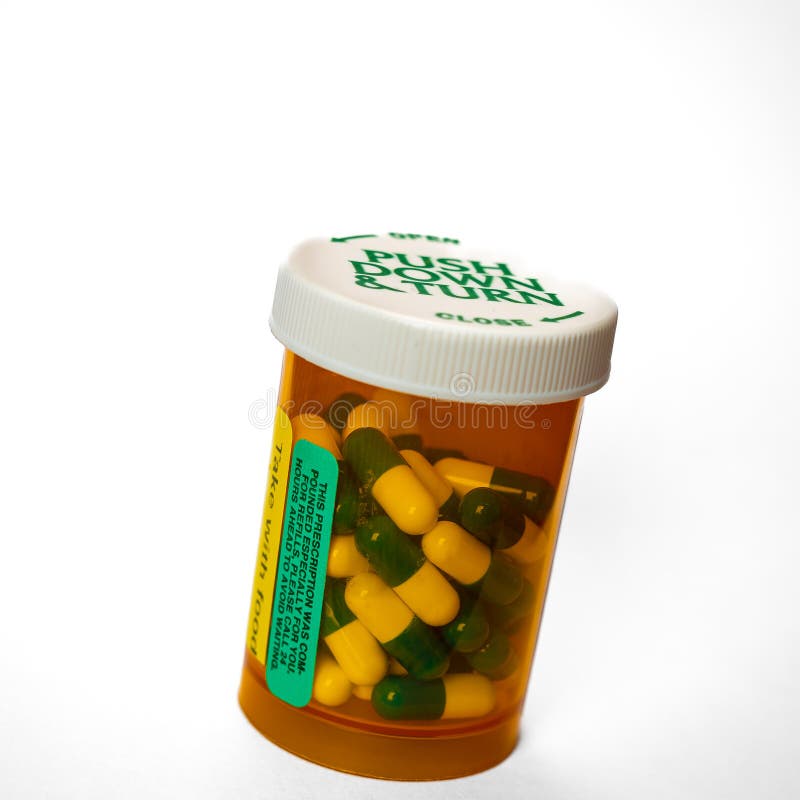 Prescription Medication Capsules Plastic Orange Pill Bottle And White