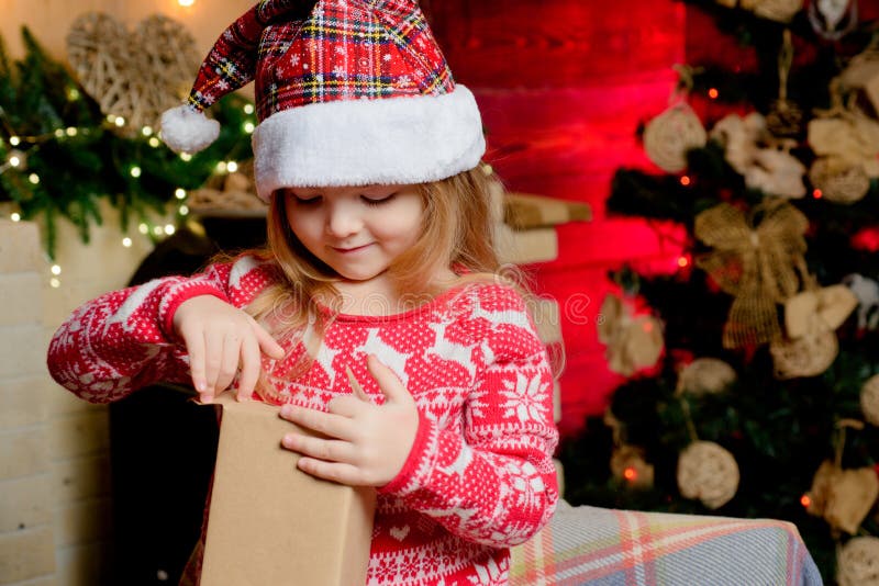 Present box. Gift. Girl in new year clothes. Christmas eve. Celebrate christmas. . Happy new year.