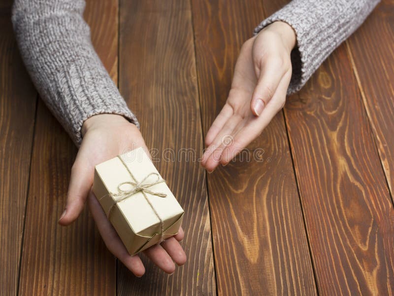 Present, gift. Close up of female hands holding small gift royalty free stock photo Present, gift. Close up of female hands holding small gift royalty free stock photo