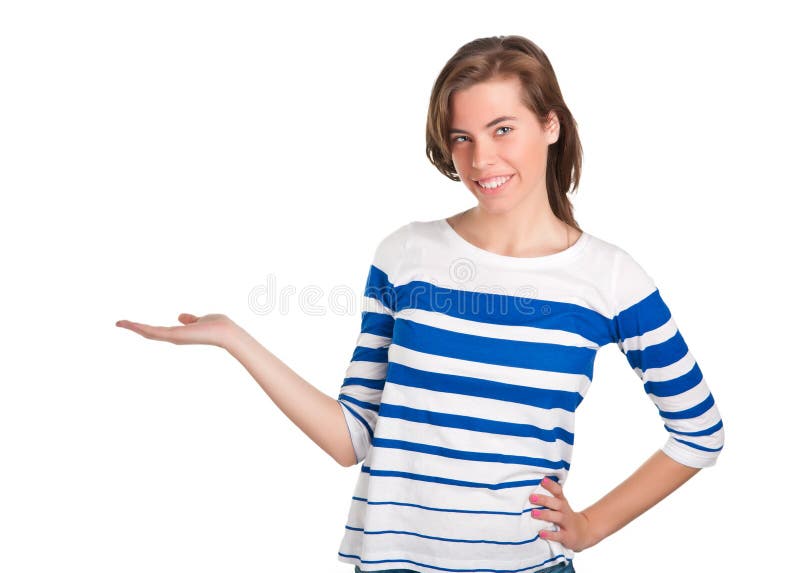 Young woman standing with her hand outstretched, as though she is presenting a product. Young woman standing with her hand outstretched, as though she is presenting a product