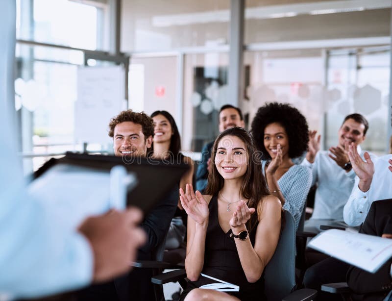 Presentation goals Making an impact while getting a message across. Shot of a group of businesspeople clapping during a royalty free stock photography