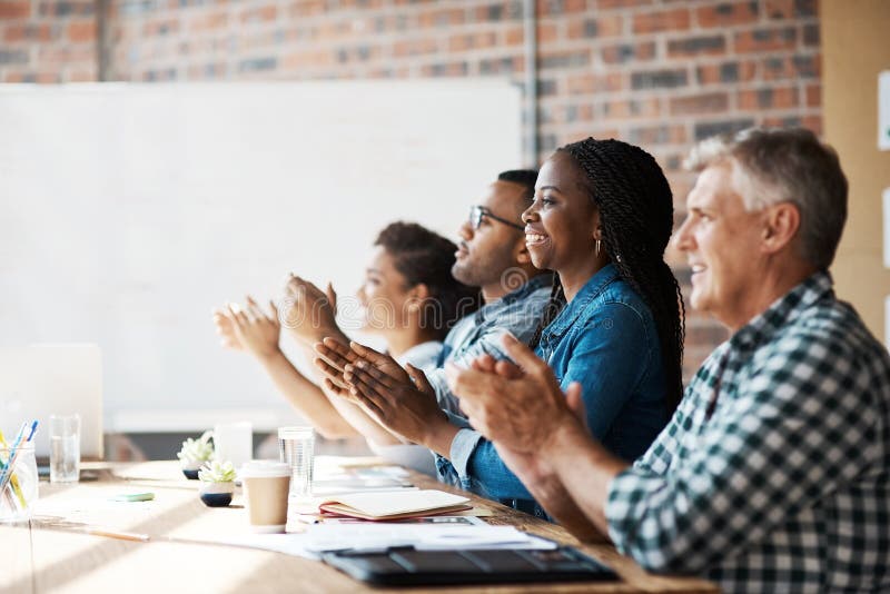 The presentation that left a lasting impression. a group of businesspeople clapping hands during a boardroom meeting. Boardroom table clapping stock images, royalty-free photos and pictures