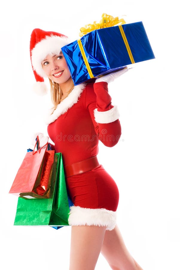 Presentes de Natal carreg da menina bonita foto de stock Presentes de Natal carreg da menina bonita foto de stock