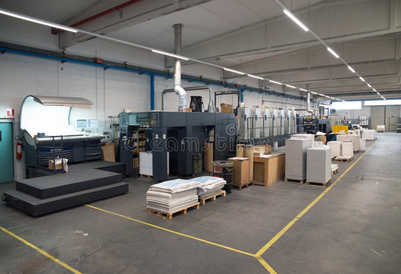 Press printing - Offset machine. Printing technique where the inked image is transferred from a plate to a rubber blanket, then to royalty free stock photo