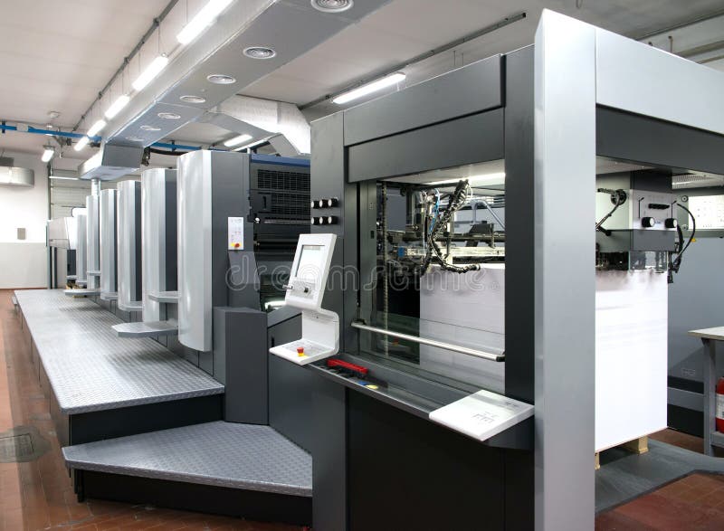Press printing - Offset machine. Printing technique where the inked image is transferred from a plate to a rubber blanket, then to royalty free stock images